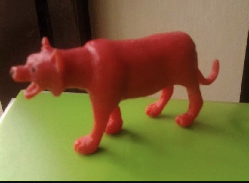 Handcrafted red soap carving of a dog sculpture by thesculptnshape artist