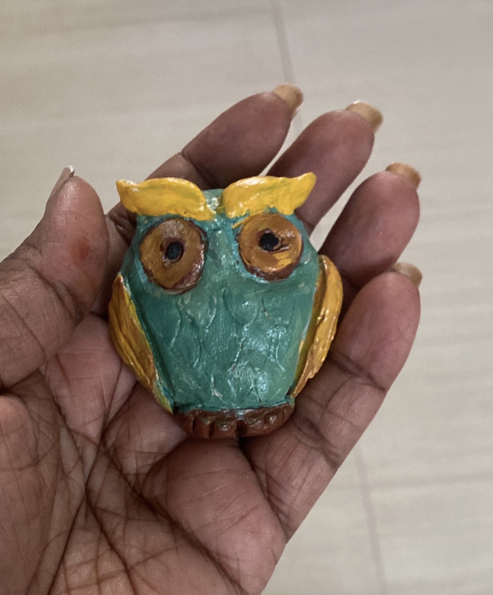 Vibrant Clay Bird - A burst of color and life, sculpted from the heart. Each feather tells a story of creativity.